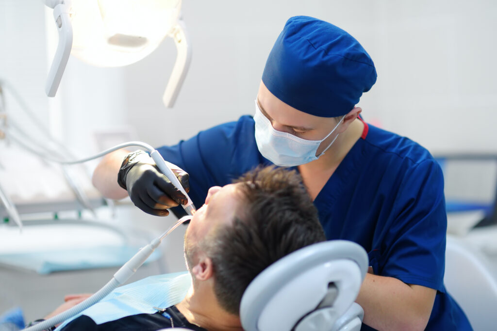 A man in a dental chair getting dental implants